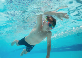 Boy swimming in a pool